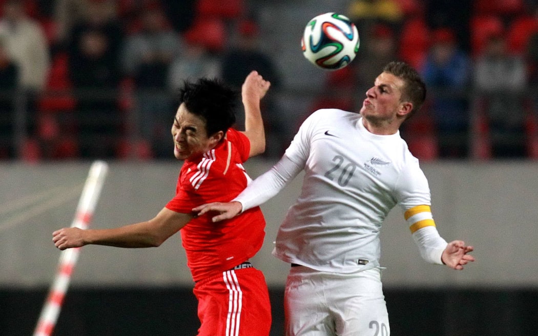 Chris Wood in aerial action in the draw with China