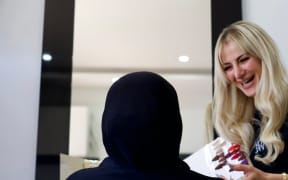 Hairdresser Rana Karnib (right) serves hijab-wearing clients everyday.