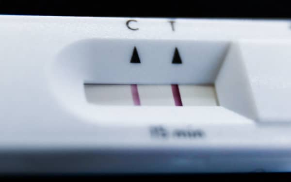 A positive result of rapid antigen test is seen in this illustration photo