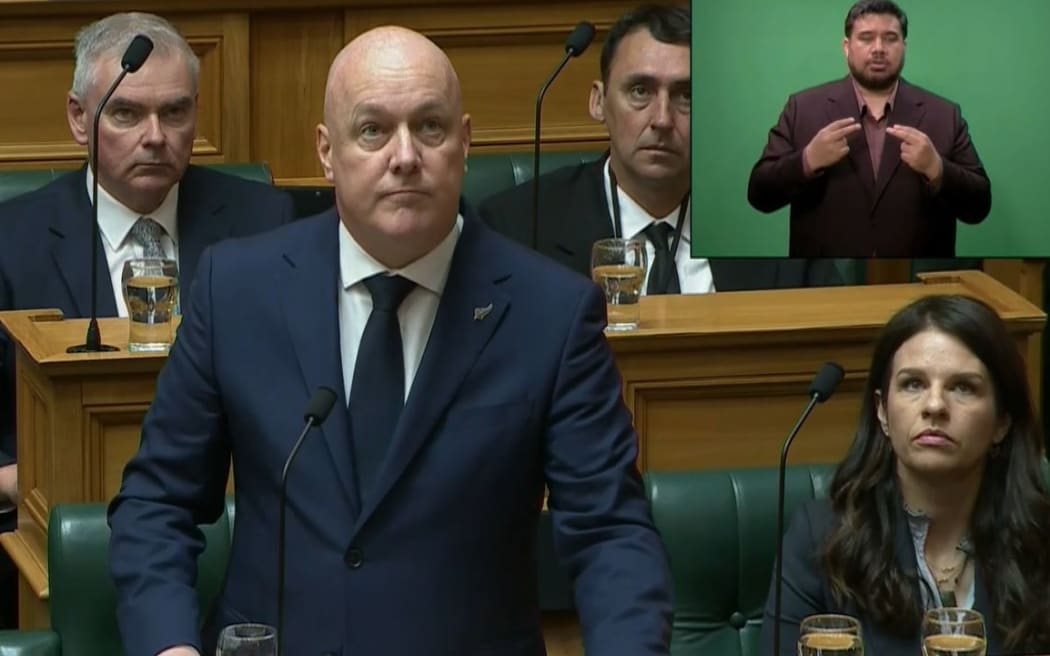 PM Christopher Luxon as the apology was disrupted by shouting in Parliament.