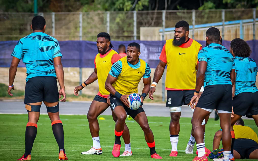 Jiuta Wainiqolo attacks with the ball at training.