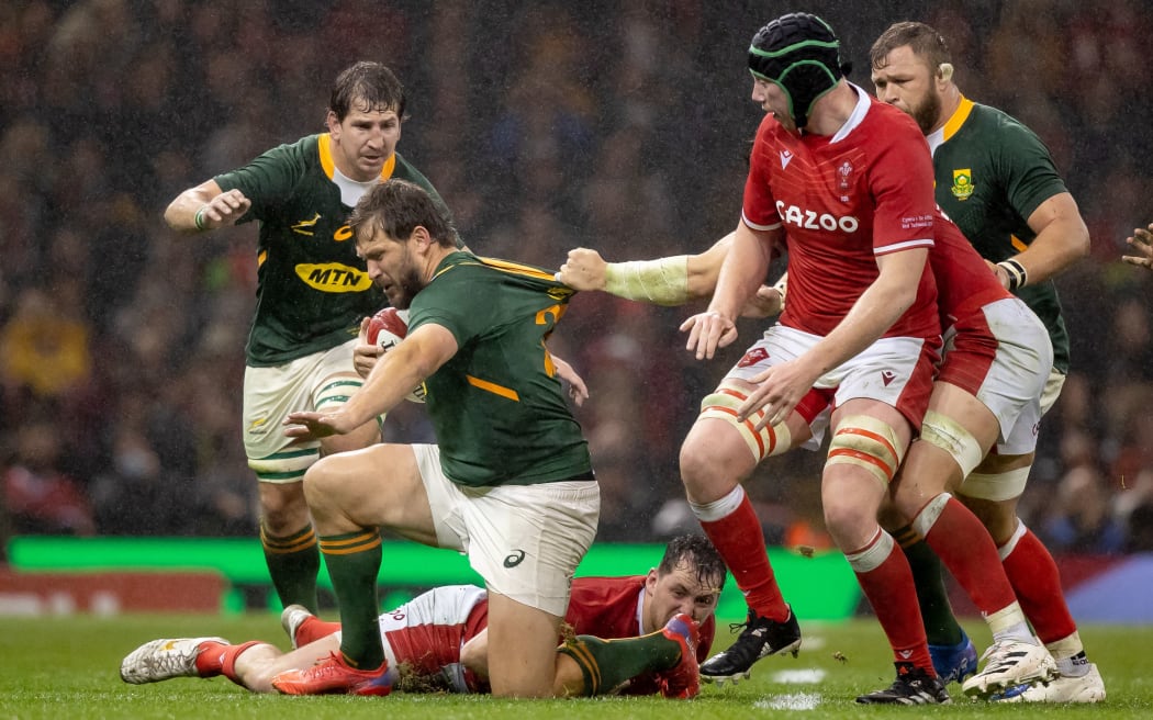 South Africa's Frans Steyn is collared by the Welsh defence.