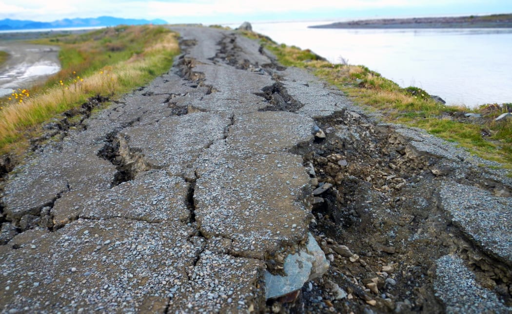 Lateral spreading happens when liquefaction stretches and tears the ground. This example happened during the 2011 Christchurch earthquake.