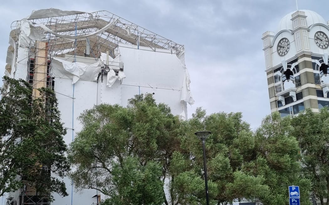 Builders' wrap torn from the Atkinson Building in downtown New Plymouth after strong winds from Cyclone Gabrielle. The building is currently the being refurbished by Te Atiawa iwi.