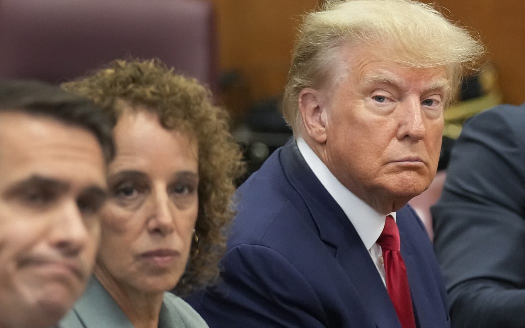 NEW YORK, NEW YORK - APRIL 04: Former U.S. President Donald Trump sits at the defense table with his defense team in a Manhattan court during his arraignment on April 4, 2023, in New York City. Trump was arraigned during his first court appearance today following an indictment by a grand jury that heard evidence about money paid to adult film star Stormy Daniels before the 2016 presidential election. With the indictment, Trump becomes the first former U.S. president in history to be charged with a criminal offense.   Seth Wenig-Pool/Getty Images/AFP (Photo by POOL / GETTY IMAGES NORTH AMERICA / Getty Images via AFP)
