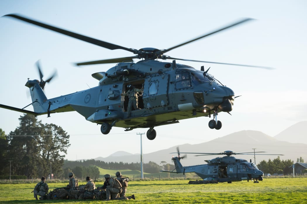 Two NH90 helicopters of the Royal New Zealand Air Force touch down and release New Zealand Army soldiers to secure an area in the town of Ward, as part of exercise Southern Katipo.