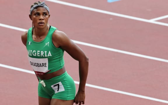 Nigeria's Blessing Okagbare reacts after winning her race in the women's 100m heats during the Tokyo 2020 Olympic Games at the Olympic Stadium in Tokyo. -
