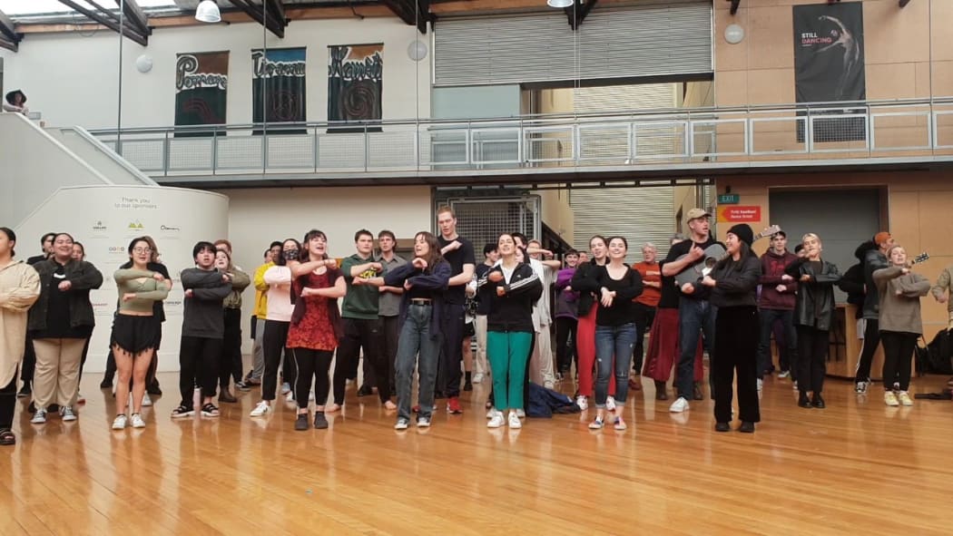 More than 100 staff and students from drama school, Toi Whakaari, gathered to sing the school waiata Toi Whakaari E