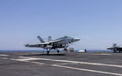 This US Navy handout photo released on May 6, 2026 by US Central Command Public Affairs shows an F/A-18E Super Hornet landing aboard Nimitz-class aircraft carrier USS George H.W. Bush (CVN 77) at sea on April 27, 2026. The United States has completed its offensive operations against Iran, Secretary of State Marco Rubio said on May 5, even as Washington warned it was ready to unleash a “devastating” response to any new attacks on shipping in the Strait of Hormuz. Rubio’s remarks came after Washington’s top military officer said American forces remain ready to resume combat operations if ordered, as clashes in the vital waterway threatened to unravel a fragile ceasefire. (Photo by US NAVY / AFP) / RESTRICTED TO EDITORIAL USE - MANDATORY CREDIT “AFP PHOTO / US NAVY / NAVCENT PUBLIC AFFAIRS” - HANDOUT - NO MARKETING NO ADVERTISING CAMPAIGNS - DISTRIBUTED AS A SERVICE TO CLIENTS