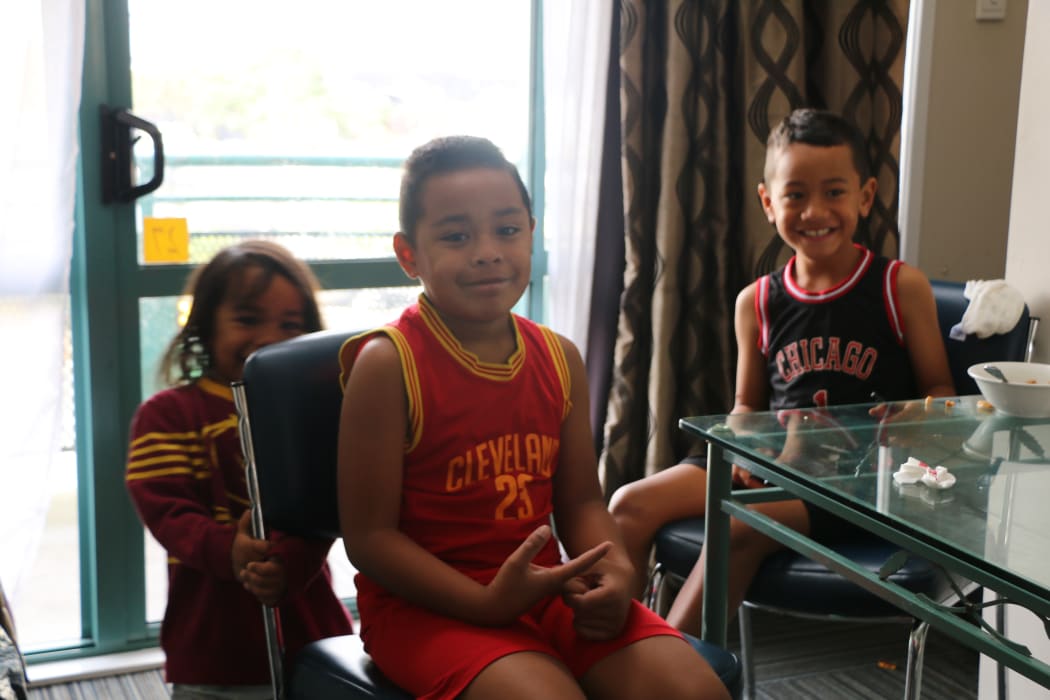 Three of the eight Milovale children, who have not returned to school since the fire burned their home.