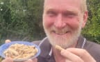 Don Neale with some huhu grubs.