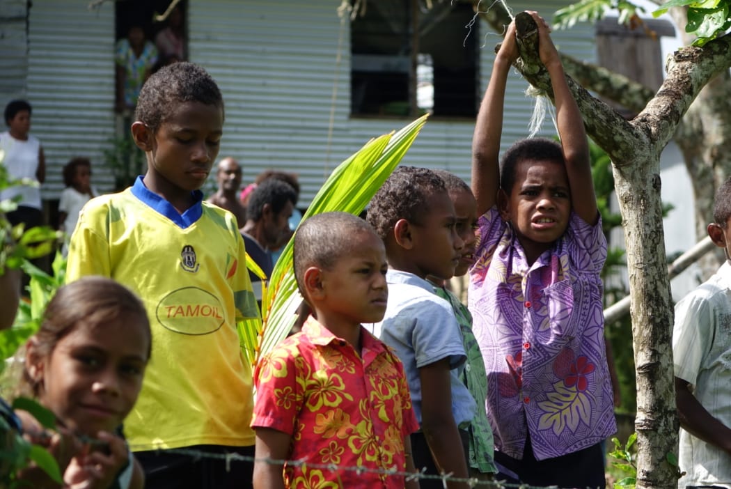 The children of Nawaisomo in the Fiji highlands are getting used to choppers landing in their remote village