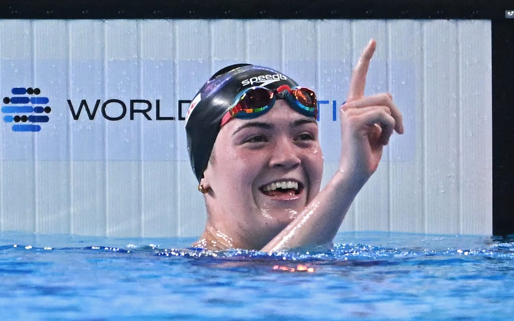 New Zealand's Erika Fairweather celebrates winning the final of the women's 400m freestyle swimming event during the 2024 World Aquatics Championships in Doha.