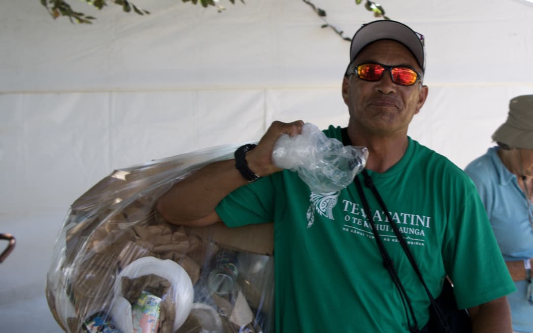 Michael Waiwiri, from Taranaki iwi Ngāti Maru, is one of many helping hands tasked with rubbish duty.