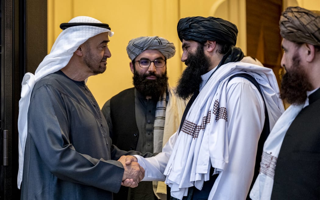 This handout picture provided by the UAE Presidential Court shows UAE President Mohamed bin Zayed al-Nahyan (L) bidding farewell to Sirajuddin Haqqani (2nd-R), interior minister of the Taliban administration of Afghanistan, after a meeting at al-Shati Palace in Abu Dhabi on June 3, 2024. (Photo by Abdulla AL-BEDWAWI / UAE PRESIDENTIAL COURT / AFP) / === RESTRICTED TO EDITORIAL USE - MANDATORY CREDIT "AFP PHOTO / UAE PRESIDENTIAL COURT- NO MARKETING NO ADVERTISING CAMPAIGNS - DISTRIBUTED AS A SERVICE TO CLIENTS ===