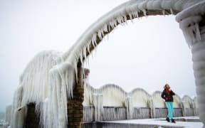 Frozen bridges, small fishing boats and stones on the coast near the Black sea town of Varna, Bulgaria, Jan. 08, 2017.