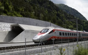 An Italian train makes its way at the north entrance of the new Gotthard Base Tunnel the world's longest train tunnel on the eve of its opening ceremony.