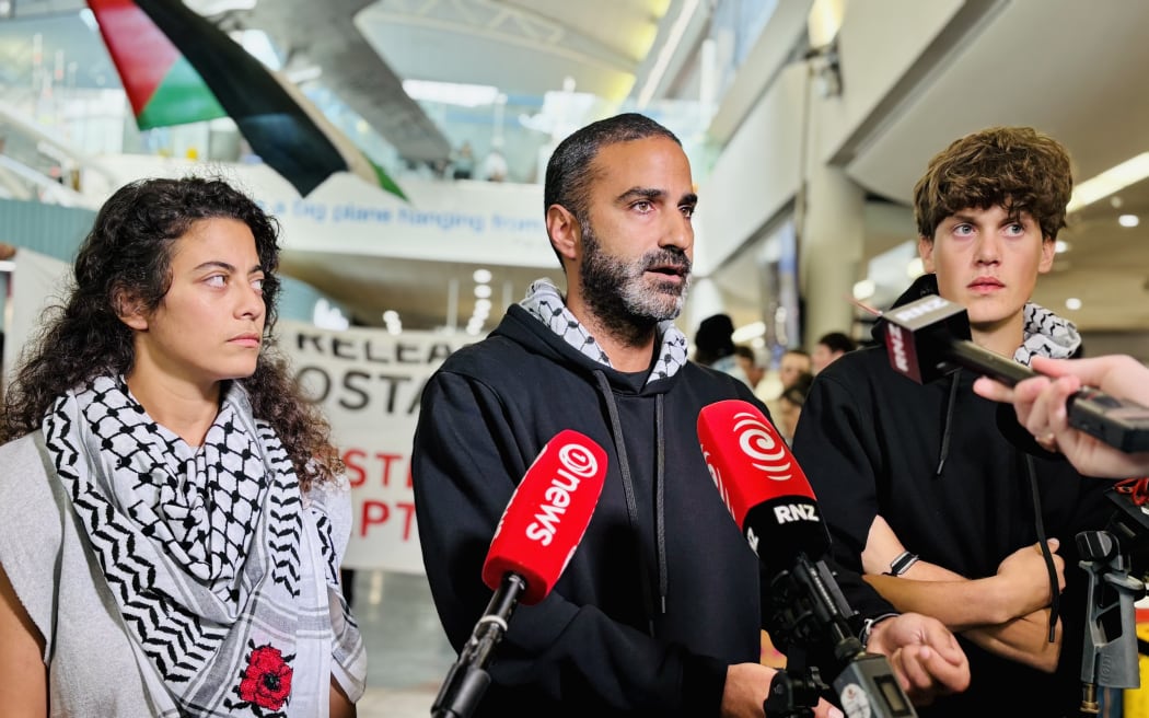 Rana Hamida, Youssef Sammour and Samuel Leason speak to media at Auckland International Airport.
