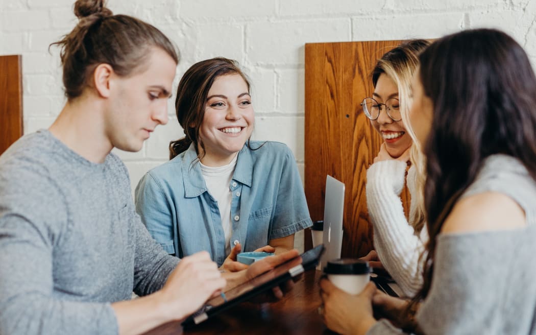 Four young people chatting