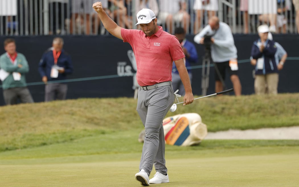 Jon Rahm of Spain celebrates making a putt for birdie on the 18th green during the final round of the 2021 U.S. Open at Torrey Pines Golf Course (South Course) on June 20, 2021 in San Diego, California.
