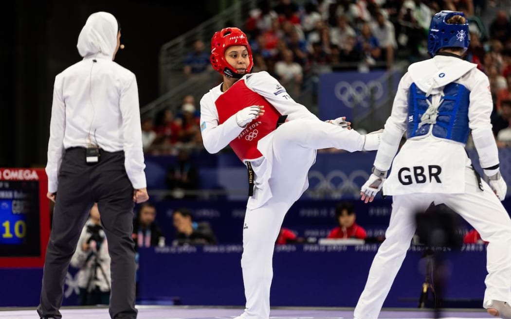 Fiji's Venice Traill (in red) competes in the women's taekwondo over 67kg round of 16. Photo: Casey Sims/ONOC