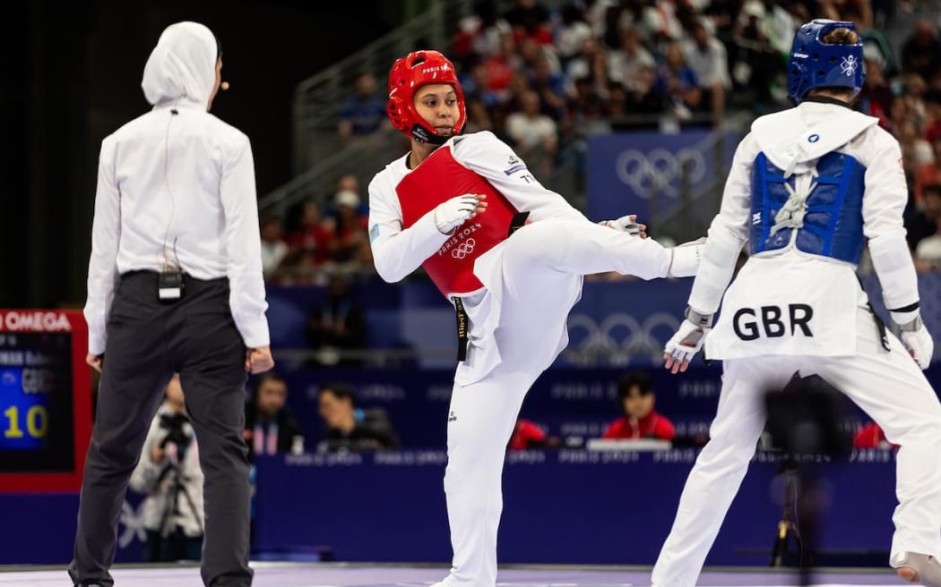 Fiji's Venice Traill (in red)  in action in the taekwondo women’s +67kg Round of 16. Photo: Casey Sims/ONOC