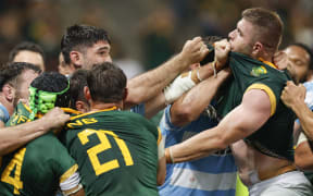 South Africa's hooker Malcolm Marx (R) is grabbed by Argentine players while involved in a scuffle during the Rugby Championship Test match between South Africa and Argentina at Mbombela Stadium in Mbombela on September 28, 2024. (Photo by PHILL MAGAKOE / AFP) /