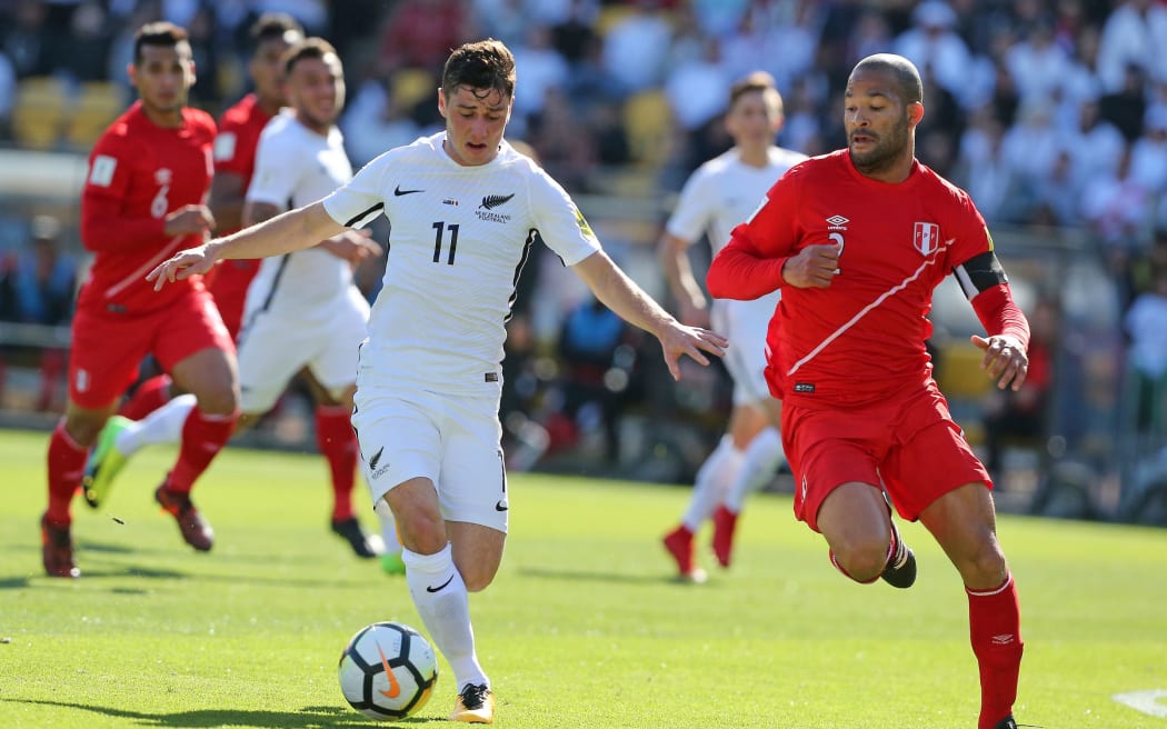 All Whites Marco Rojas dribbles the ball.