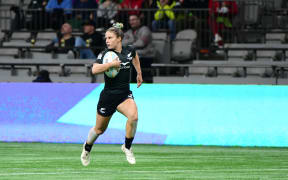 New Zealand's Michaela Brake runs to score another try during the World Rugby Sevens Series women's match against Ireland.