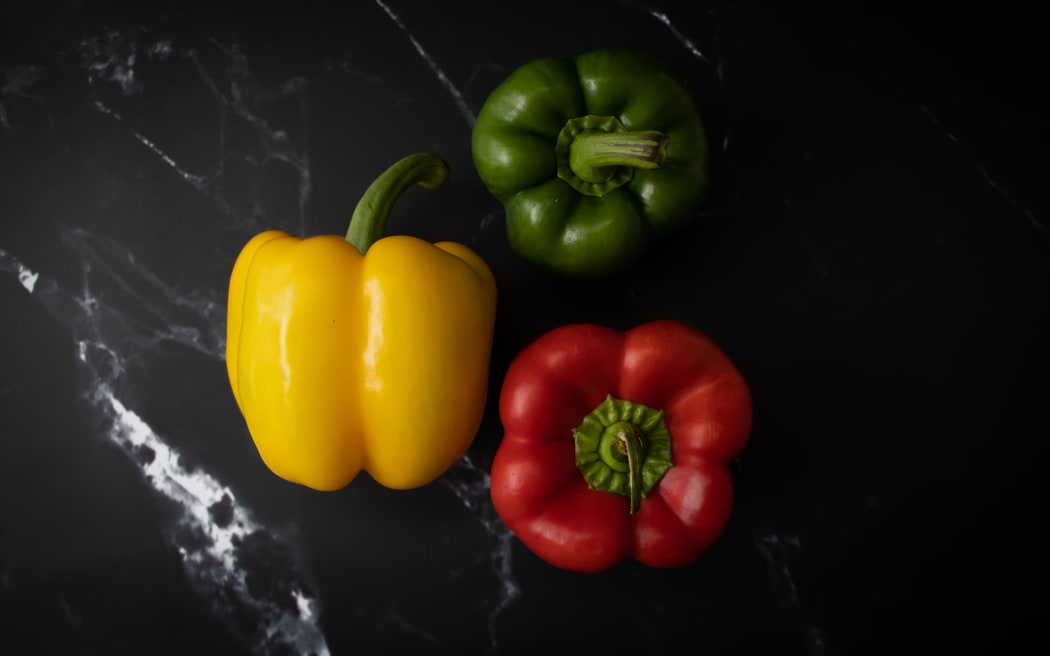 Yellow, green and red capsicums.