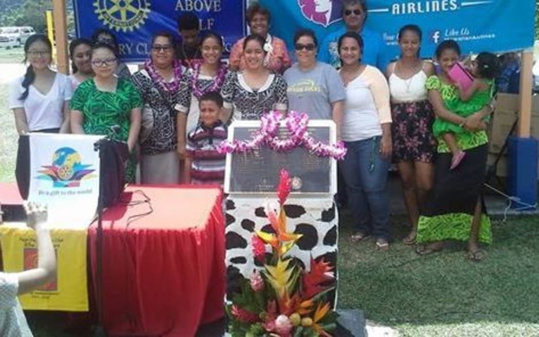 People gather at a memorial service for in American Samoa for victims of the 2009 tsunami.