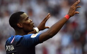 France's midfielder Paul Pogba celebrates France's victory at the end of the Russia 2018 World Cup round of 16 football match between France and Argentina at the Kazan Arena in Kazan on June 30, 2018.