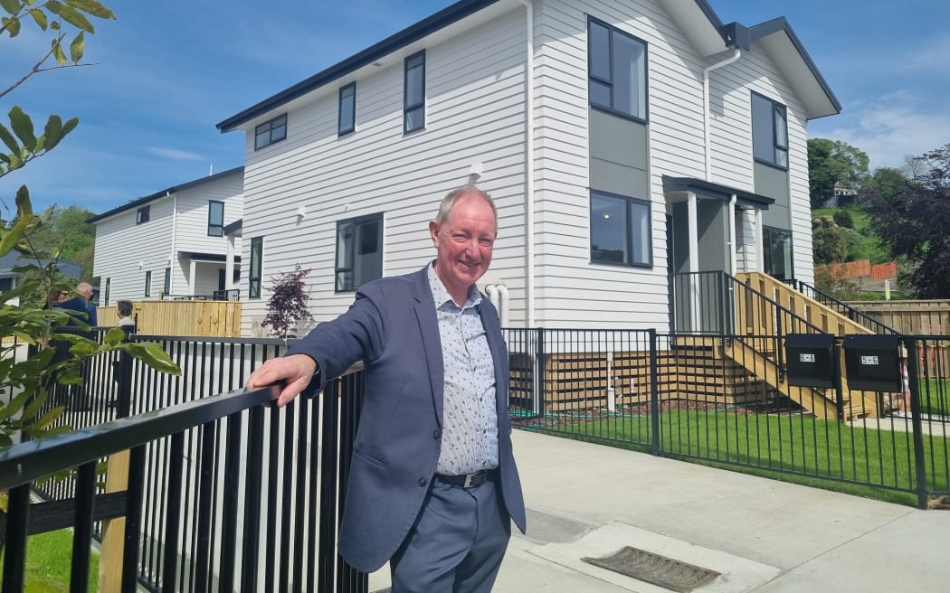 Nelson Mayor Nick Smith outside the new housing trust homes.