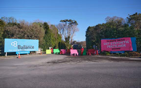About five activists from Greenpeace and Climate Justice Taranaki have erected signs and chained themselves to material blocking the Ballance Agri Nutrients factory entrance in Kapuni.