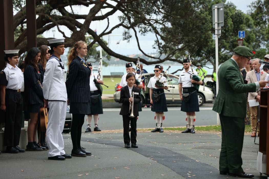 Celine waiting to perform at a Remembrance Service in 2024