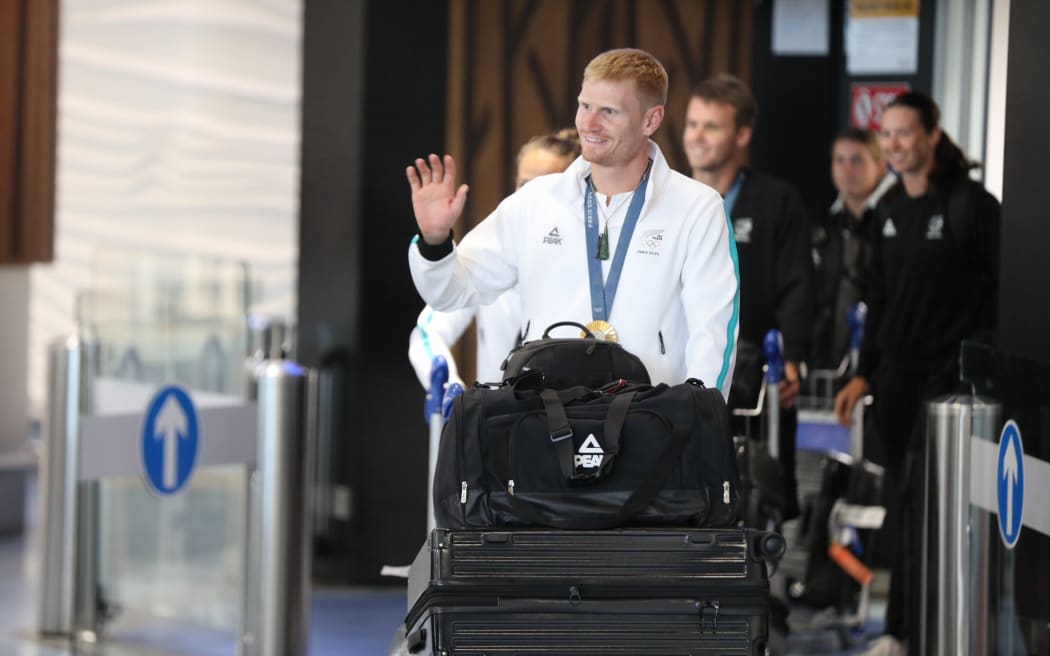 Olympic athletes including Dame Lisa Carrington have arrived at Auckland International Airport from Paris on August 14.