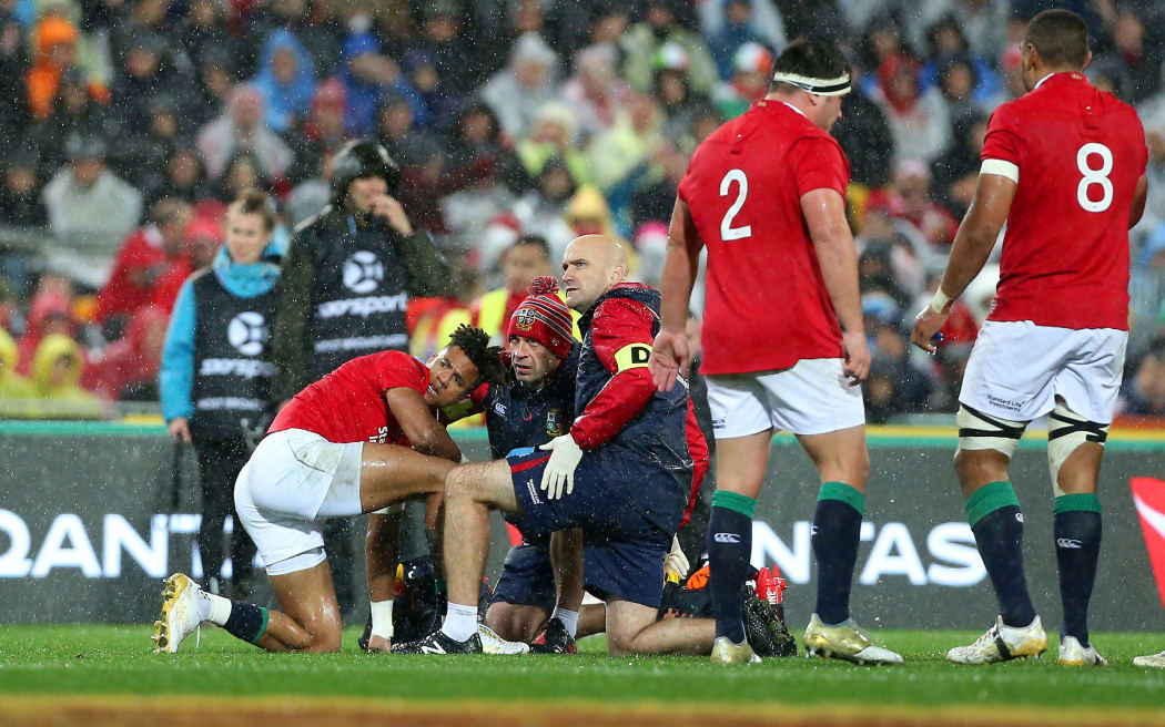 Lions player Anthony Watson watches the big screen after a shoulder charge by Sonny Bill Williams.
