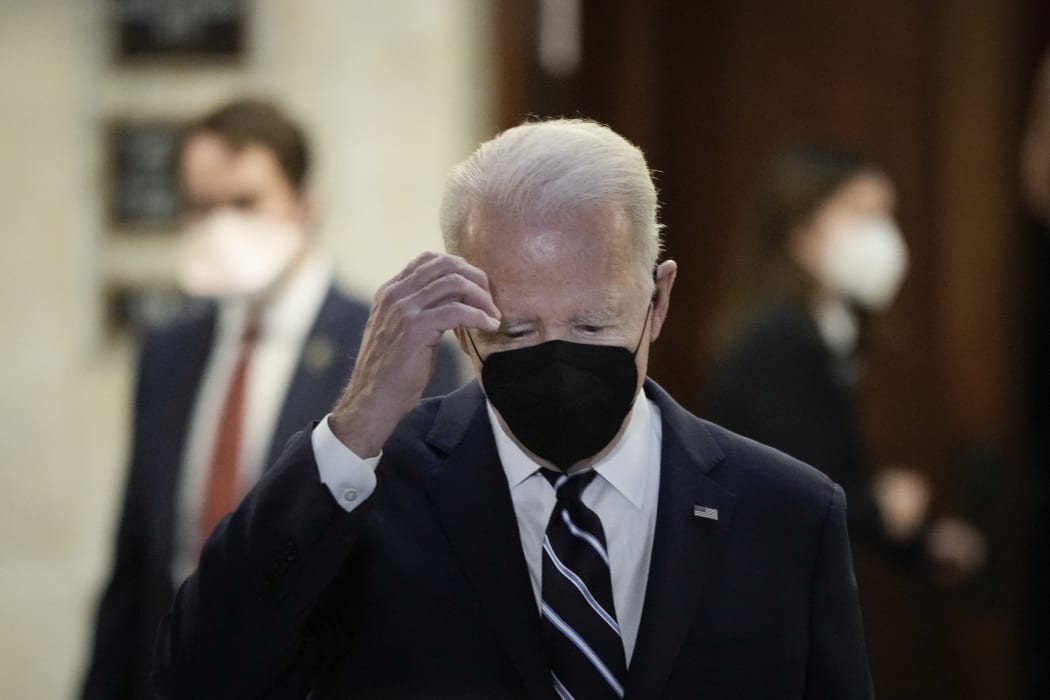 US President Joe Biden leaves a meeting with Senate Democrats in the Russell Senate Office Building on Capitol Hill on January 13, 2022 in Washington, DC.