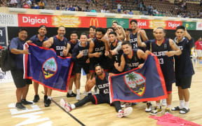 Guam celebrate winning gold at the 2019 Pacific Games.