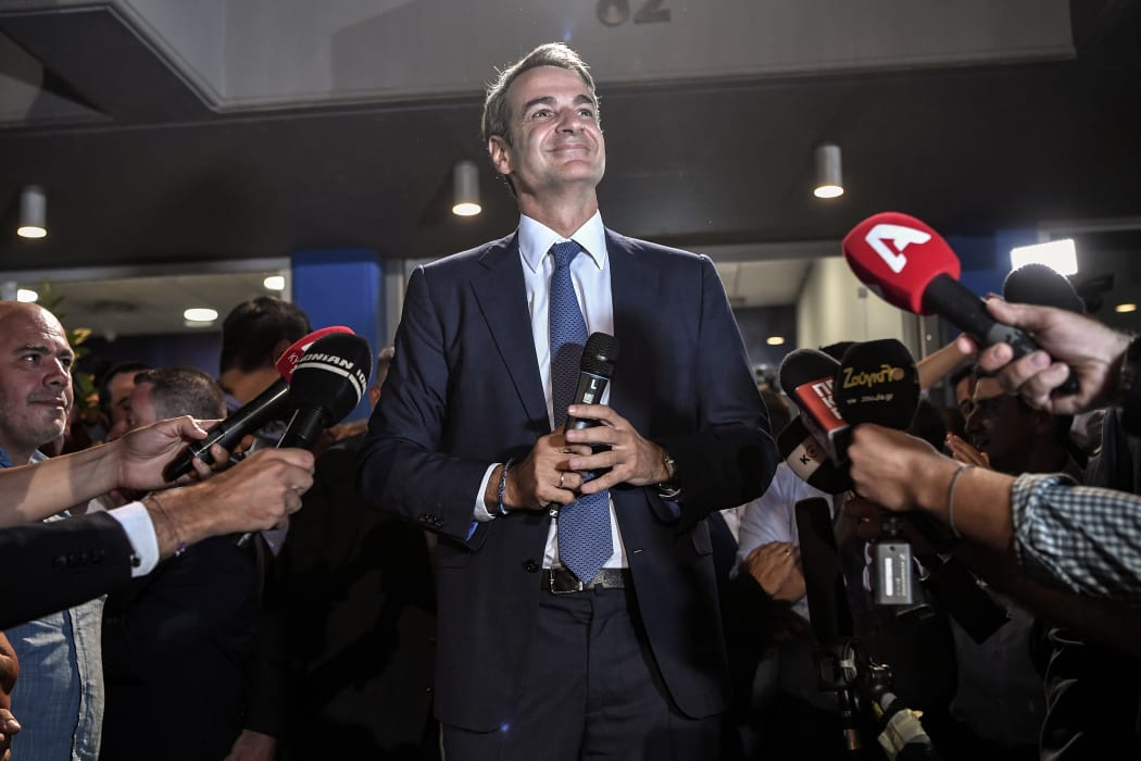 Greece's newly elected Prime Minister and leader of conservative New Democracy party Kyriakos Mitsotakis, speaks to the press outside the party's headquarters after the official results of the elections, in Athens on 7 July, 2019.