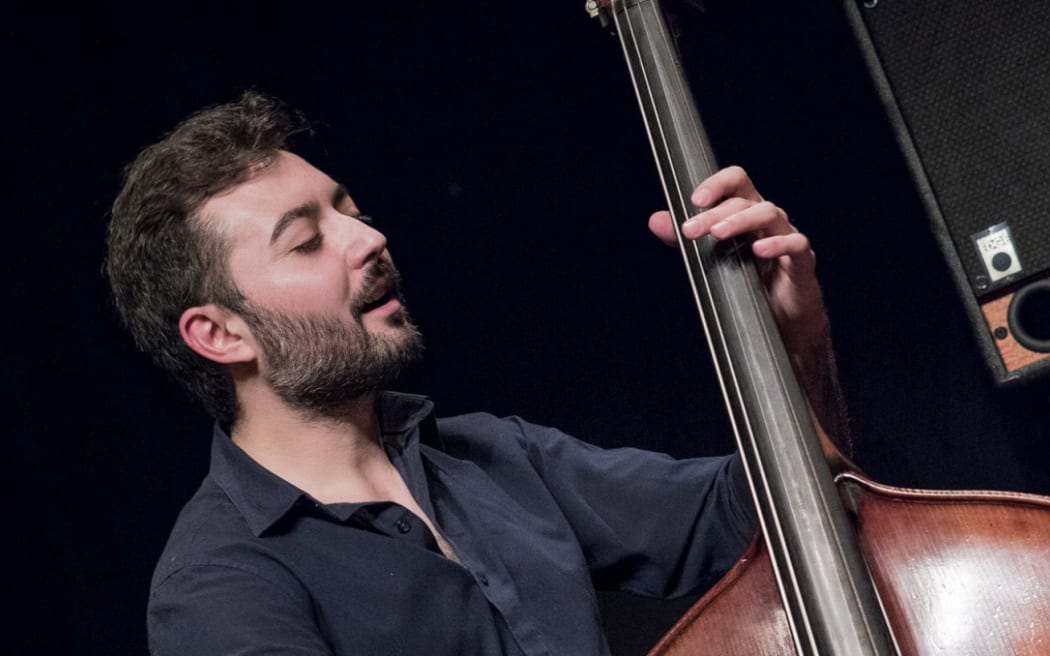 Bass player Giuseppe Millaci playing double bass