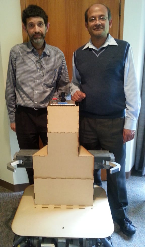 A photo of Ken Mercer and Gourab Sen Gupta with the hospital bed mover