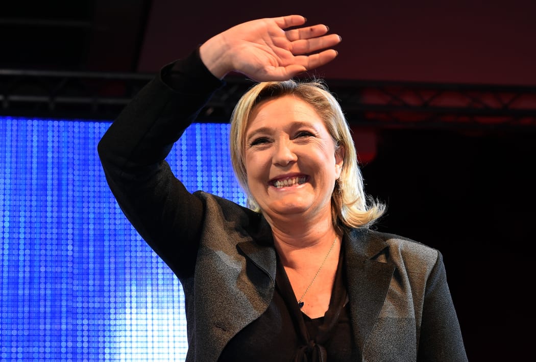 National Front leader Marine Le Pen reacts during a campaign meeting in Nimes on 2 December ahead of the upcoming regional elections.