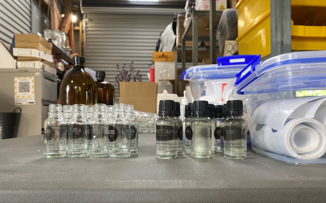 Bottles of award-winning Grosso oil line the table in Damian's shed.
