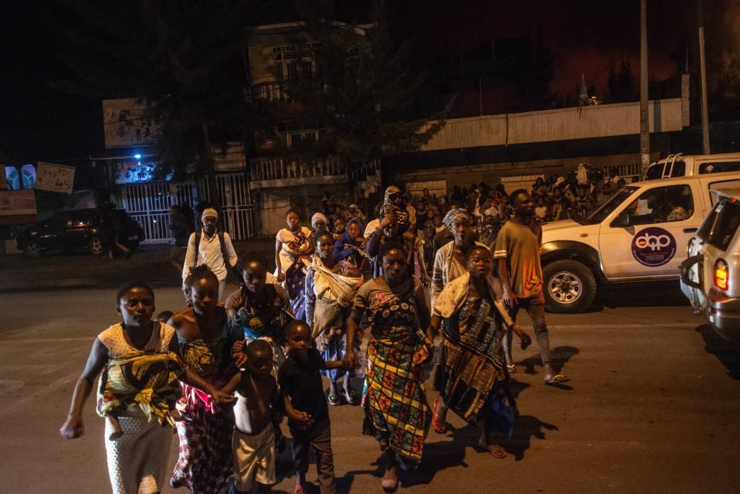 Goma residents are seen leaving the city following a sudden activity of the Nyiragongo volcano on 22 May 2021.
