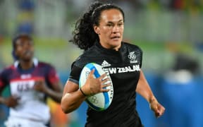 New Zealand's Portia Woodman scores a try in the women’s rugby sevens quarter-final match between New Zealand and USA during the Rio 2016 Olympic Games at Deodoro Stadium in Rio de Janeiro on August 7, 2016.