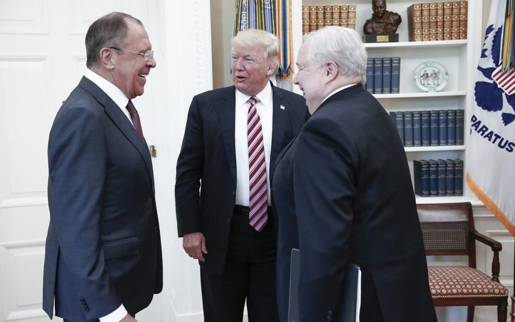 This file handout photo taken on May 10, 2017 made available by the Russian Foreign Ministry shows shows US President Donald Trump (C) speaking with Russian Foreign Minister Sergei Lavrov (L) and Russian Ambassador to the US, Sergei Kislyak during a meeting at the White House in Washington, DC.