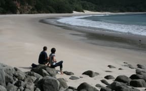 Visitors to New Chums beach in April 2010.