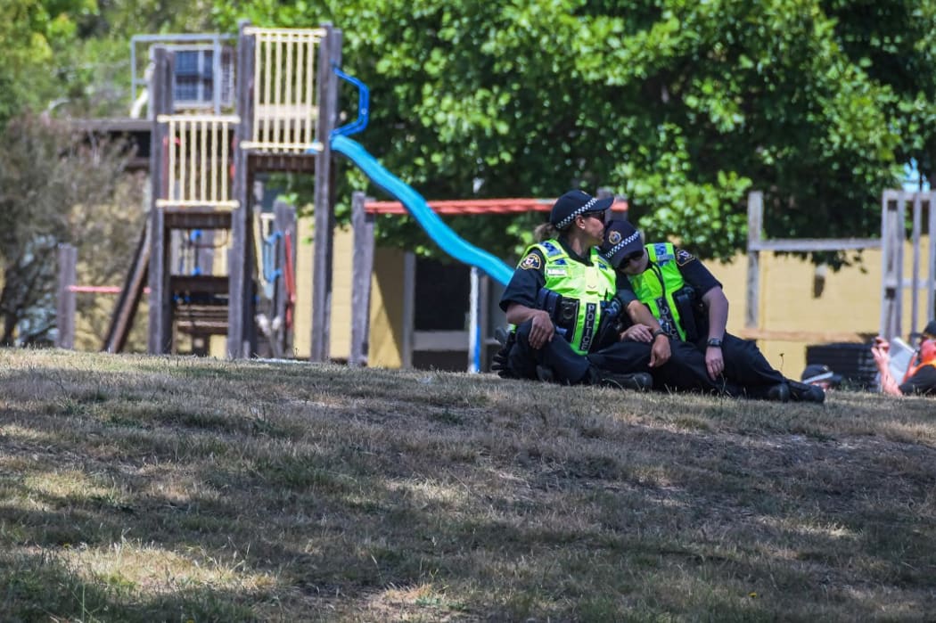 Local police near a playground outside the Hillcrest Primary School the day after five children died and four others were injured.