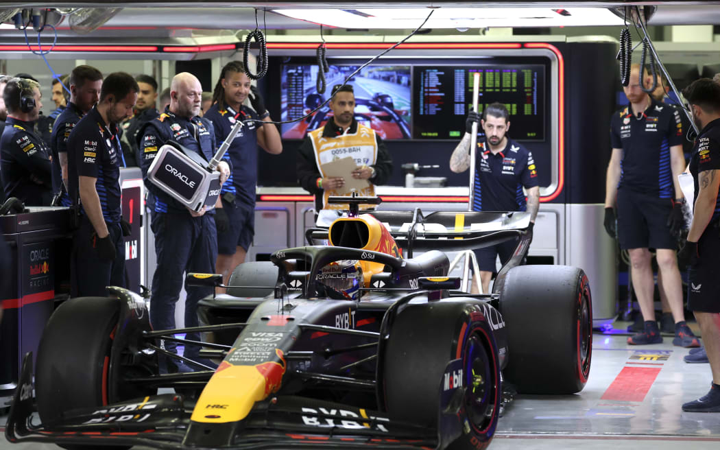 Red Bull Racing's Dutch driver Max Verstappen sits in his car at the garage during the qualifying session of the Bahrain Formula One Grand Prix at the Bahrain International Circuit in Sakhir on March 1, 2024. (Photo by ALI HAIDER / POOL / AFP)